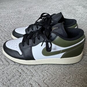 Women’s Black and Green Jordan 1 Low sneakers